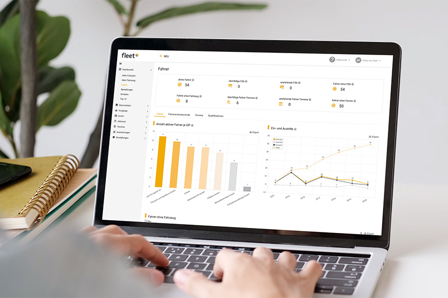 Man works on a laptop with Fleet+ and uses the dashboard view to keep an eye on the fleet's key figures